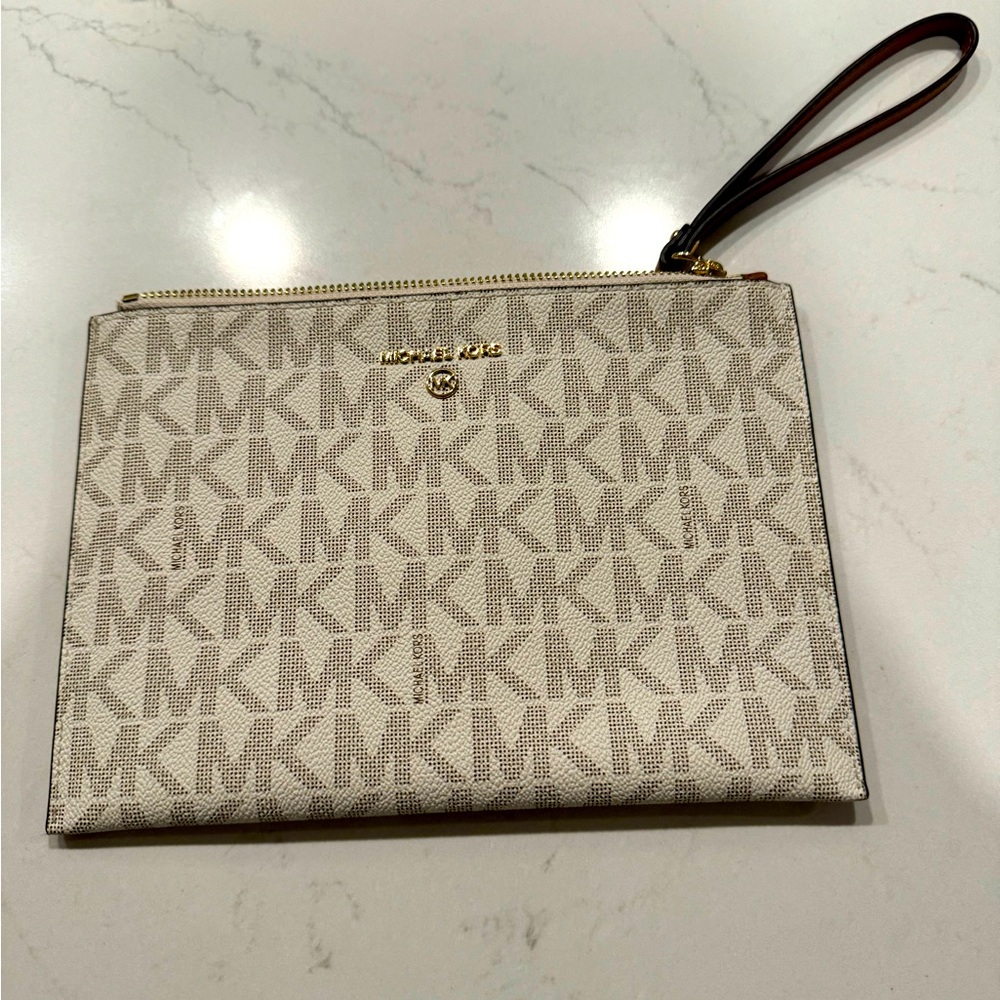 Brand New Michael Kors Jet Set Charm wristlet.